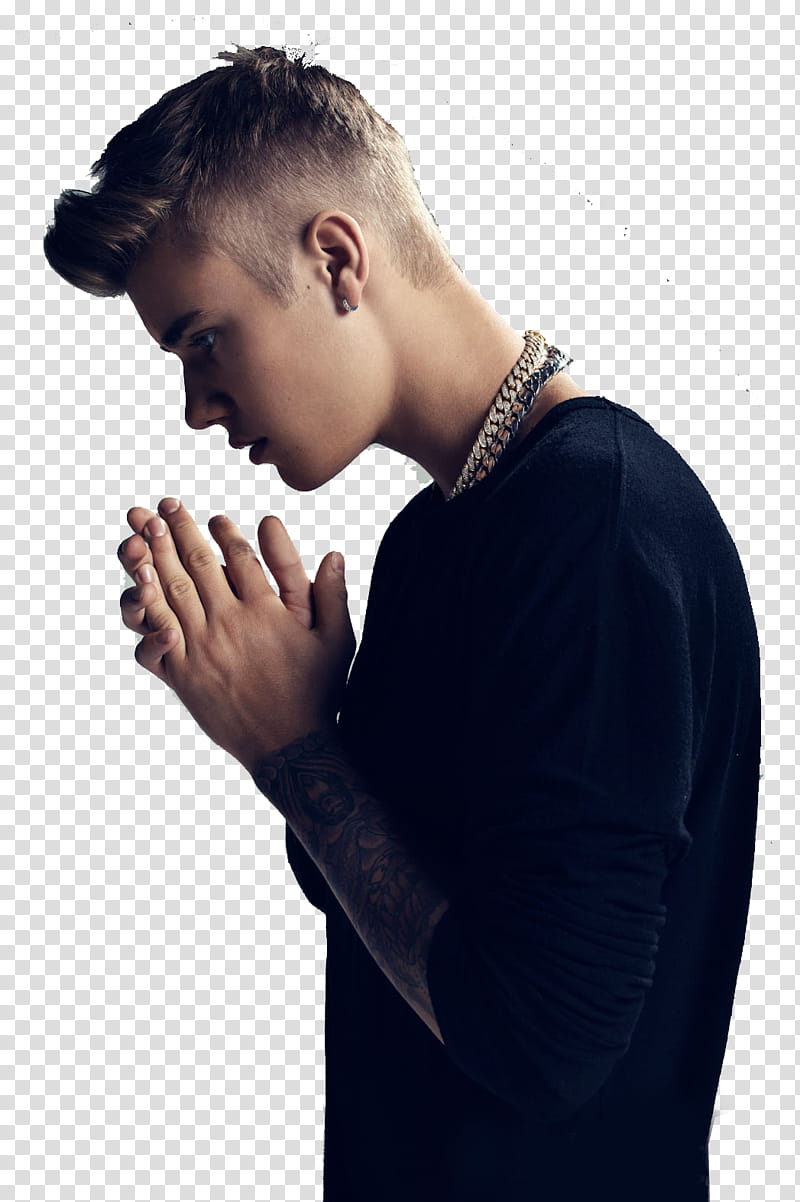 Justin Bieber, Justin Bieber closing both hands wearing black long-sleeved shirt transparent background PNG clipart