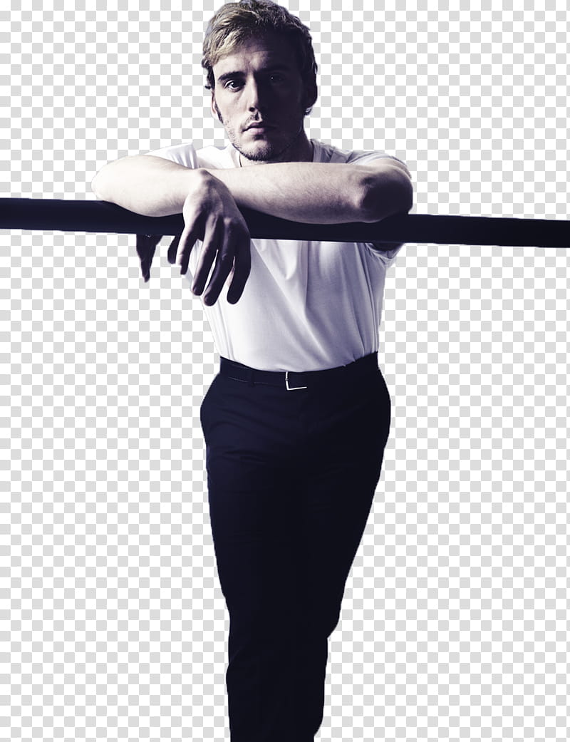 Sam Claflin, man wearing white crew-neck t-shirt and black dress pants leaning on steel bar transparent background PNG clipart