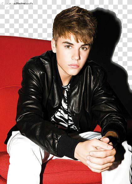 Justin Bieber, Justin Beiber sitting on red sofa chair transparent background PNG clipart