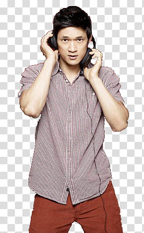 Harry Shum, Jr. wearing black wireless headphones transparent background PNG clipart