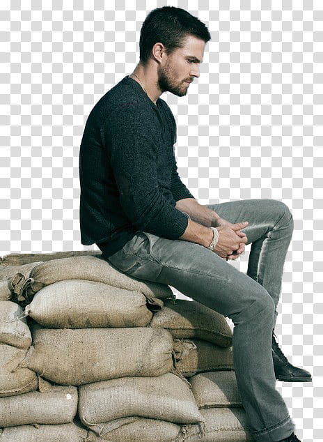 Stephen Amell, man sitting on a pile of sacks transparent background PNG clipart