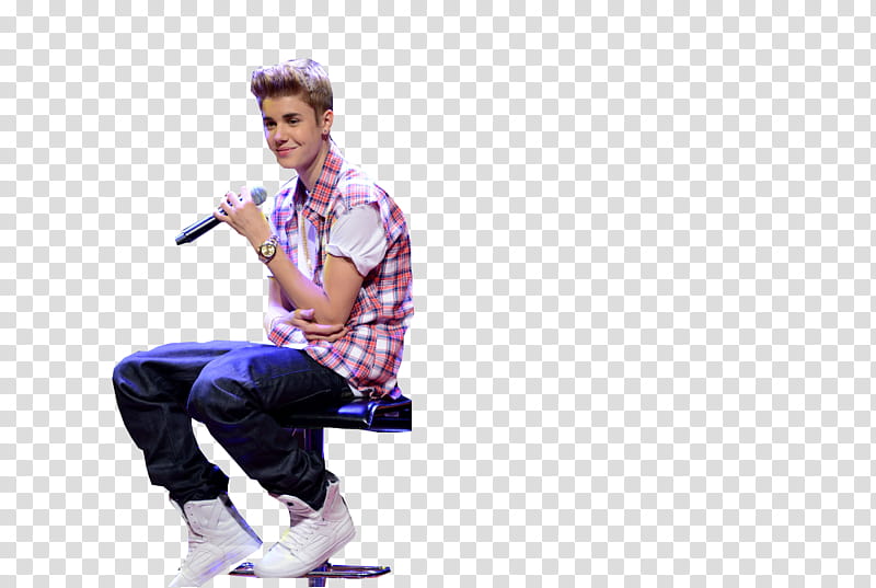 Justin Bieber, smiling Justin Bieber sitting on chair and holding microphone transparent background PNG clipart