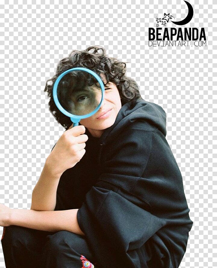 Finn Wolfhard, boy holding magnifying glass transparent background PNG clipart