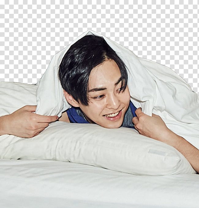 Xiumin EXO IDOTB, man lying on bed transparent background PNG clipart