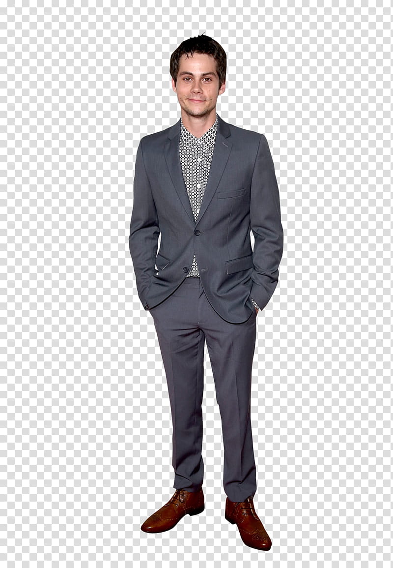 Dylan O brien , standing man wearing gray blazer with both hands in pockets transparent background PNG clipart