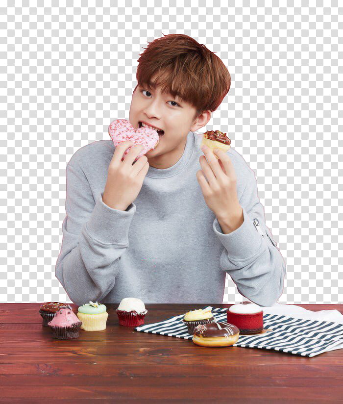 Yoo Seonho Ize Magazine, man sitting and eating cupcakes transparent background PNG clipart